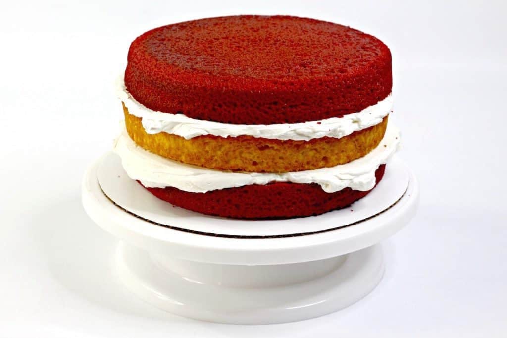 three layer cake with frosting in between layers