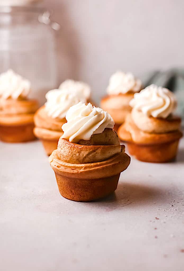 cinnamon roll cupcakes with frosting on top