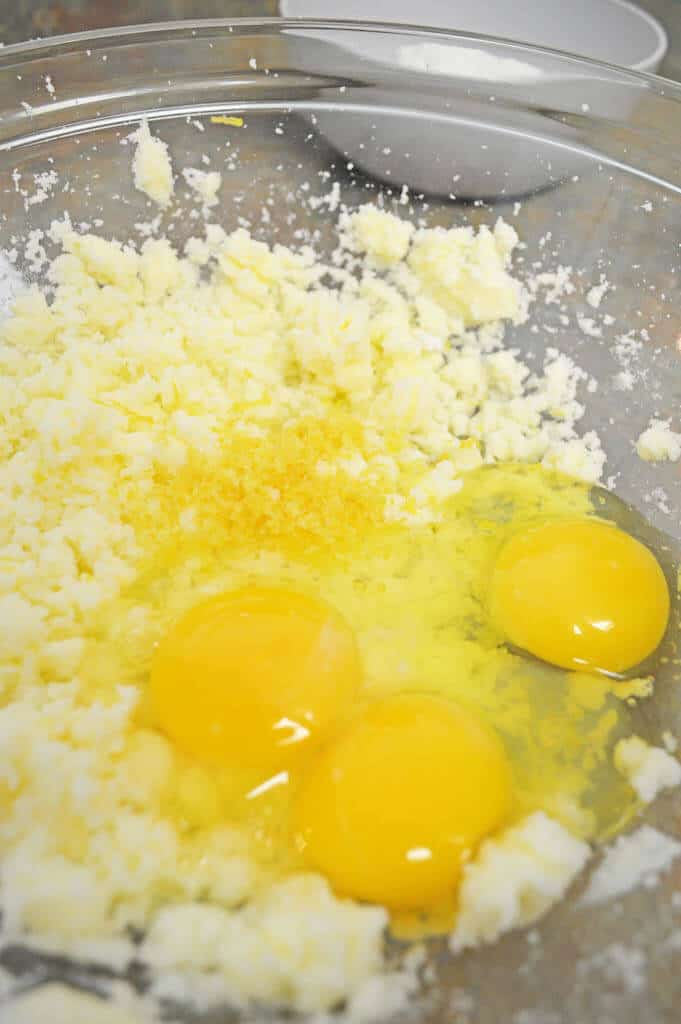 Lemon Blondies ingredients with eggs being mixed in.