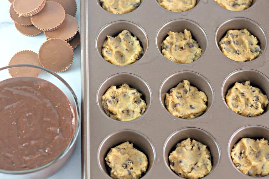 cookie dough filled in a muffin tin.