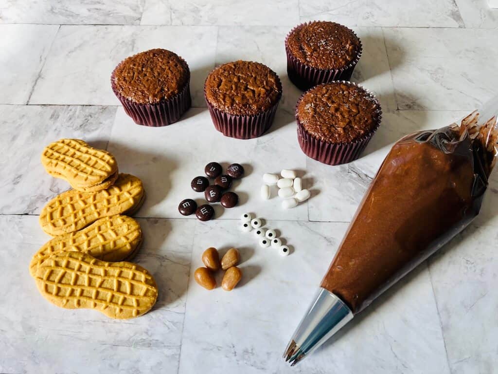 ingredients for beaver cupcakes on a table.
