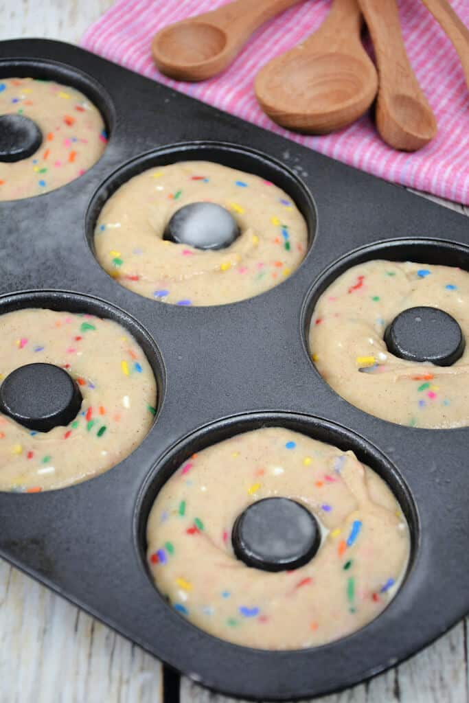 funfetti donuts in a donut pan.
