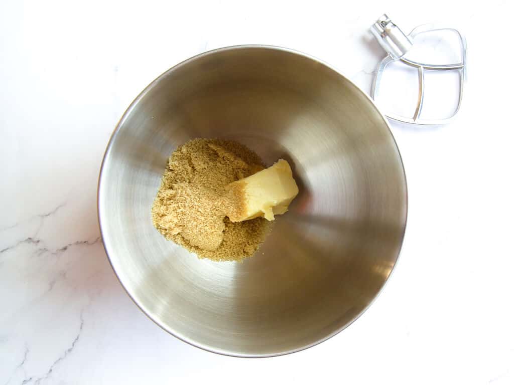 Mixing the butter and brown sugar in a bowl.