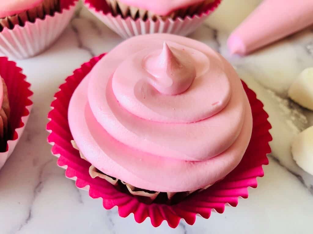 pink Frosting on a cupcake.