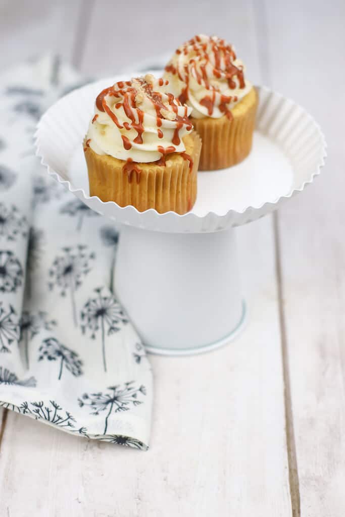 2 Cinnamon cupcakes on a white plate.
