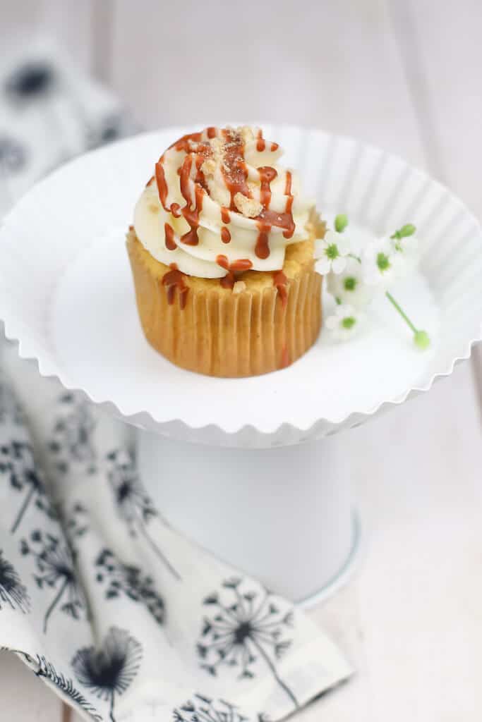 Cinnamon toast crunch cupcakes on a white plate.